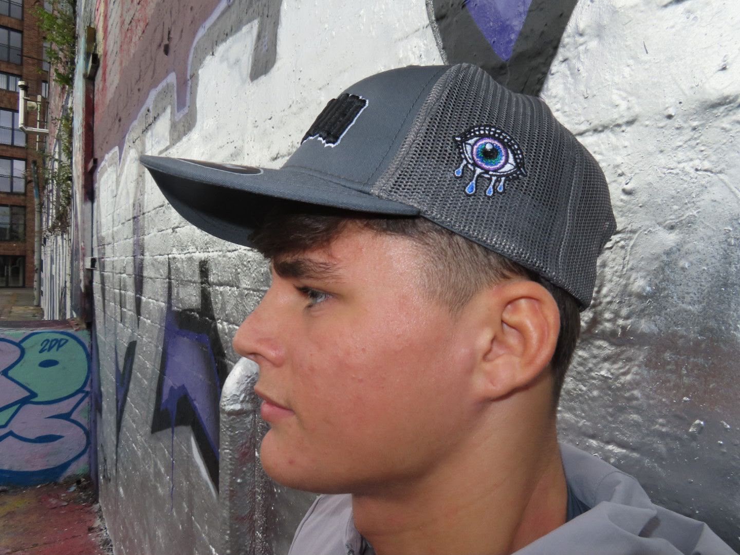 Close-up of the signature embroidered eye on The Original